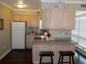 Lots of storage in this fully stocked kitchen-blender and coffee maker included!