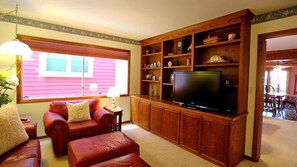 Den with TV is a great place for the sports fanatics and kids to relax.