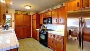 Well equipped kitchen for six. Gas BBQ on patio and pass through window to patio