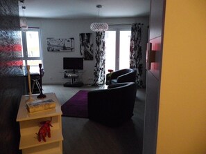 Entry to Studio with View of Pierre d'Afrique Wall, Balcony and Large Window