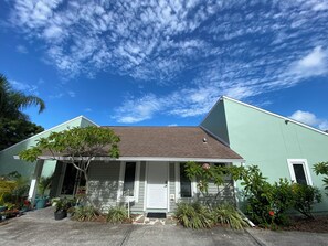 Front of the house and your own private entrance. Park in front of your door. 