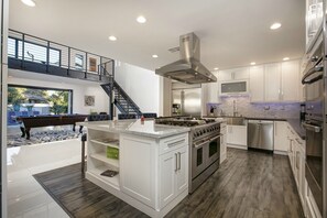 GOURMET KITCHEN WITH VIEW OF POOL