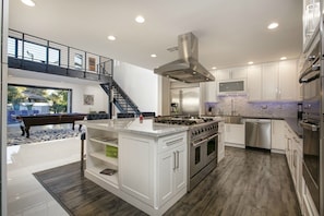 GOURMET KITCHEN WITH VIEW OF POOL