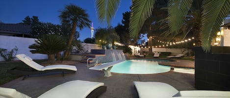 POOL AT NIGHT WITH STRATOSPHERE HOTEL IN VIEW.  SO CLOSE TO THE STRIP!