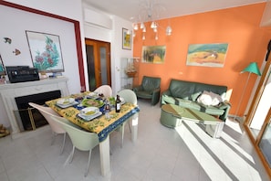 Seating area in the living room with comfortable real leather chairs.