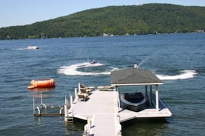 View of doc, boat lifts across to Bluff