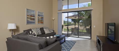 Comfortable living room with golf course views.