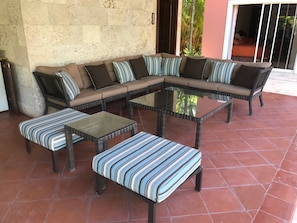 Outdoor Sitting Area Next to BBQ and Dining Table