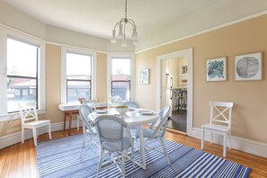 Serena and Lilly dining furniture, soaring ceilings, and built-in cabinetry.