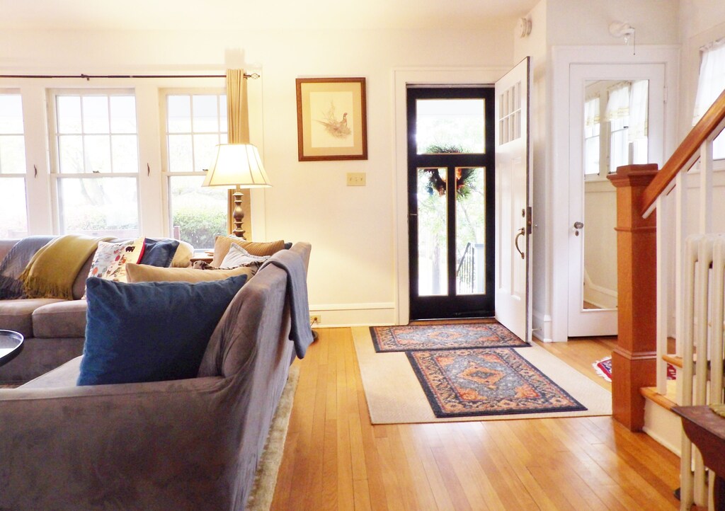 Front entry area with couch and staircase visible at a popular Burlington Vermont VRBO