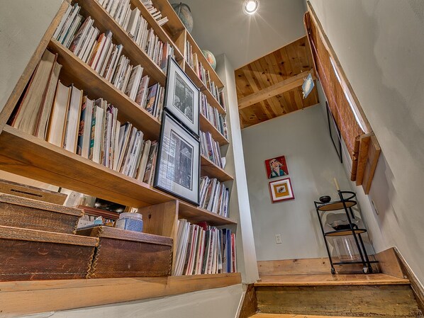 Entrance to the studio.Book lined staircase.