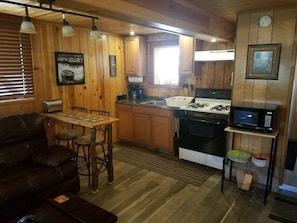 Kitchenette w/everything you need:
stove,microwave,coffee maker,toaster,fridge.
