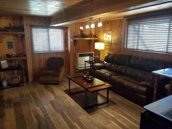 Cozy studio, fully furnished. Reclining sofa. Convenient and comfy eating area.