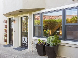 Tucked-away entrance and windows galore.