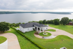 Drone view of the front of house over looking the lake