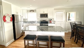 renovated kitchen with all dishware and dishwasher