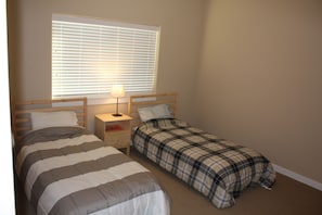 2 twin size beds in the 2nd bedroom