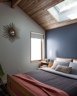 Queen bed with a skylight view to a 50 ft. Cedar tree