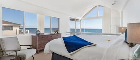 Primary bedroom has panoramic oceanfront views and an en-suite bathroom