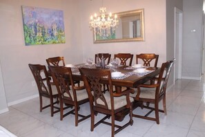 Table setting for 8 guest and a separate dinette area with 6 more       seating.