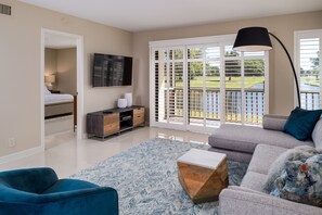 Spectacular golf course and water from the living room featuring a smart tv