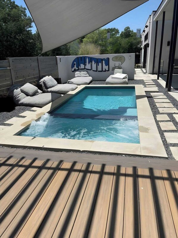 Private backyard space with pool and Large hot tub.