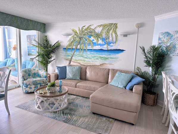 Living area with large screen TV, ocean front view