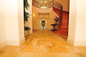 The Grand Foyer, featuring the magnificent spiral staircase and custom railing.