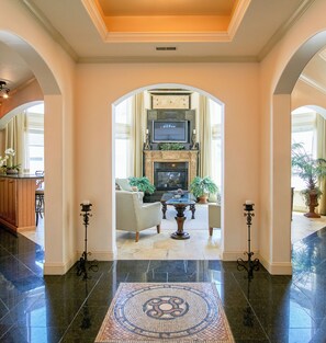 The approach to the 2 story Great Room from the central hallway.