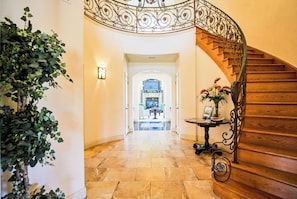 The Grand Foyer, featuring the magnificent spiral staircase and custom railing.