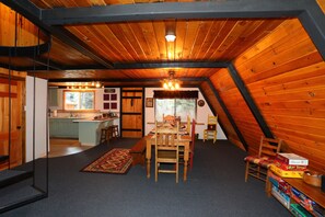 Play games together at the large table with easy access to the kitchen!
