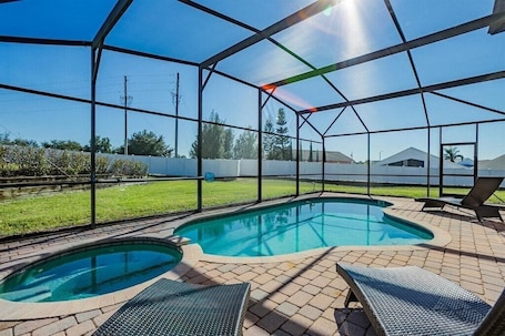 Relax by the screened-in pool and soak in the sunshine in your private outdoor oasis.