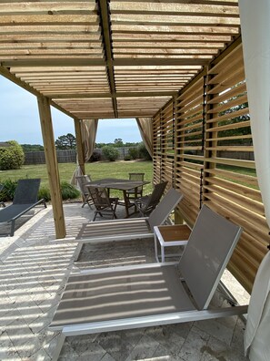 A new shuttered pergola offers shelter from the sun.  Built in 2021.