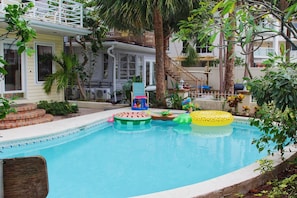 View from the patio looking towards the path that opens to the pool and the sleeps 3 unit next door