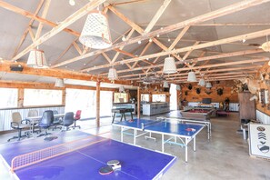 2 ping pong tables, foosball, pool, cornhole, 2 huge TVs, bathrooms, bar in barn
