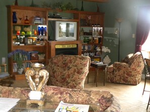 Entertainment center in front of the fireplace 
