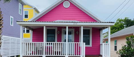 The PINK house with an inviting front porch