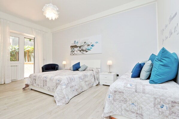 Bedroom 1 with exit to the rear terrace