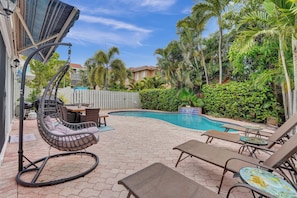 Plenty of seating for all to enjoy the back deck or jump in the 86F heated pool