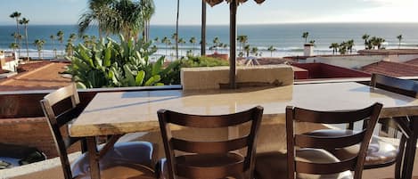 nice balcony seating for 4 with umbrella