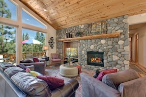 RIVER ROCK FIREPLACE FOR COZY GATHERING