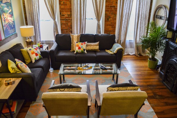 Beautiful living room with Tv over Mantle (TV not shown)