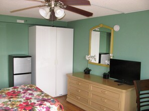 Closet with hangers, a refrigerator
