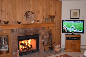 Family room with wood burning fireplace