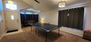 Entry, sitting room, and ping pong table