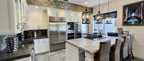 Chefs Kitchen with Wolf & KitchenAid Appliances! Open to Dining & living