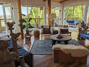 Airy relaxed tropical vibe. 5 stories high. Upper level parking at front door.