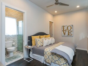 Spacious bedroom, loft style with luxury bedding