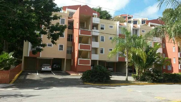 Exterior w/covered parking (1st flr - center bay holds 2 cars parked tandem)