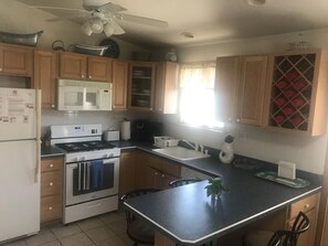 Bright Kitchen with Counter Seating for up to Five People.